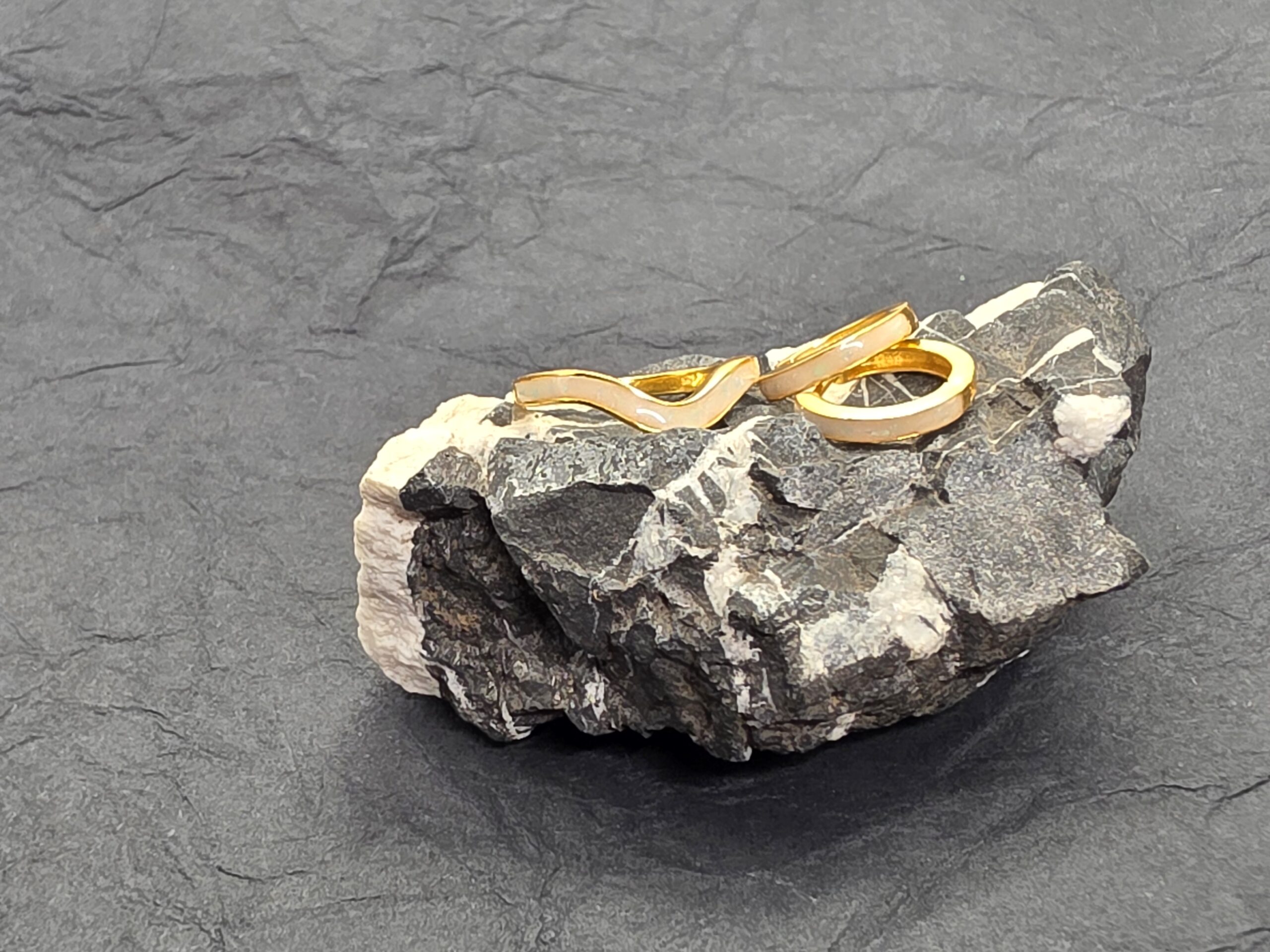 Handmade ring displayed on natural stone